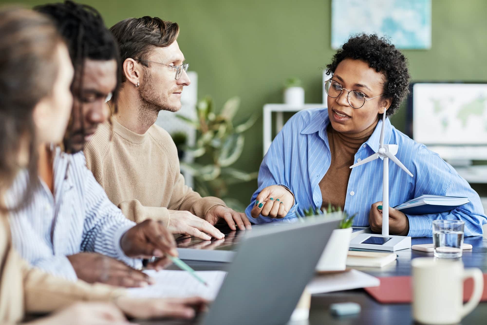 Colleagues working in team at meeting